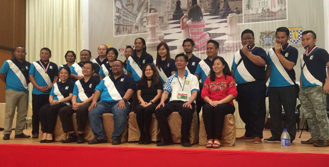 Of notable mentions were the facts that the State of Sabah sent four teams for the competition, namely, the Kinabalu Kings, Kinabalu Queens, Kinabalu Knights and Kinabalu Pawns. Additionally, two of the teams were made up of players who are hard of hearing – this is a recent training initiative sponsored by Yayasan Rakyat 1Malaysia and supported by the Penang Chess Association that is aimed at extending the inclusive nature of chess to the deaf. Adding to that, the youngest player in the chess league team was 4-year and 6 months’ old Malaysian, Ain Safiya binti Rosli of team AAAA. Ain Safiya became the youngest ever contestant in the entire chess festival!    After 8 gruelling rounds, the Filipino quartet of IM Emmanuel Senador, IM Nouri Hamed, Ian Udani and FM Alekhine Nouri of PCA Team emerged victorious to become Champion. “PCA” in the team name does not stand for Penang Chess Association. Instead, “PCA” would have likely stood for “Philippine Chess Alliance”. IM Senador and IM Hamed also won board prizes. JUMP KING, led by Deni Sonjaya, finished runner-up, while The Big Lift finished Third.