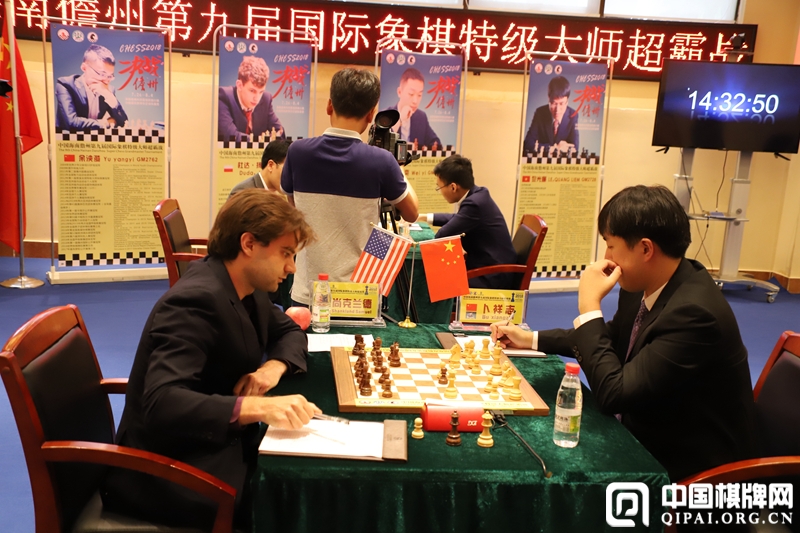 Bu Xiangzhi and Samuel Shankland during their first round game at the Danzhou Masters