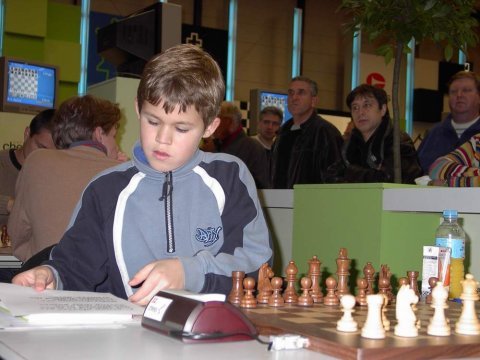 Magnus Carlsen, the Norwegian chess player who came to international  attention after winning the C group of the Corus Chess Tournament in  January 2004 at the age of thirteen, plays against Armenian