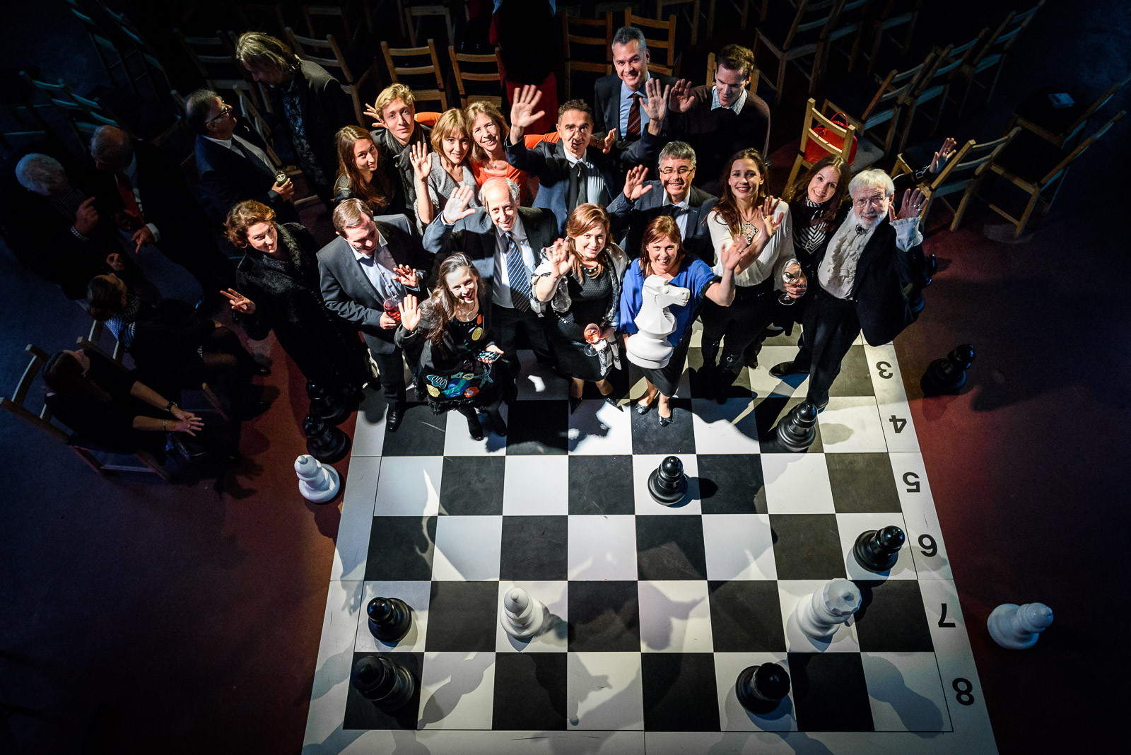 Group photo on large chess board