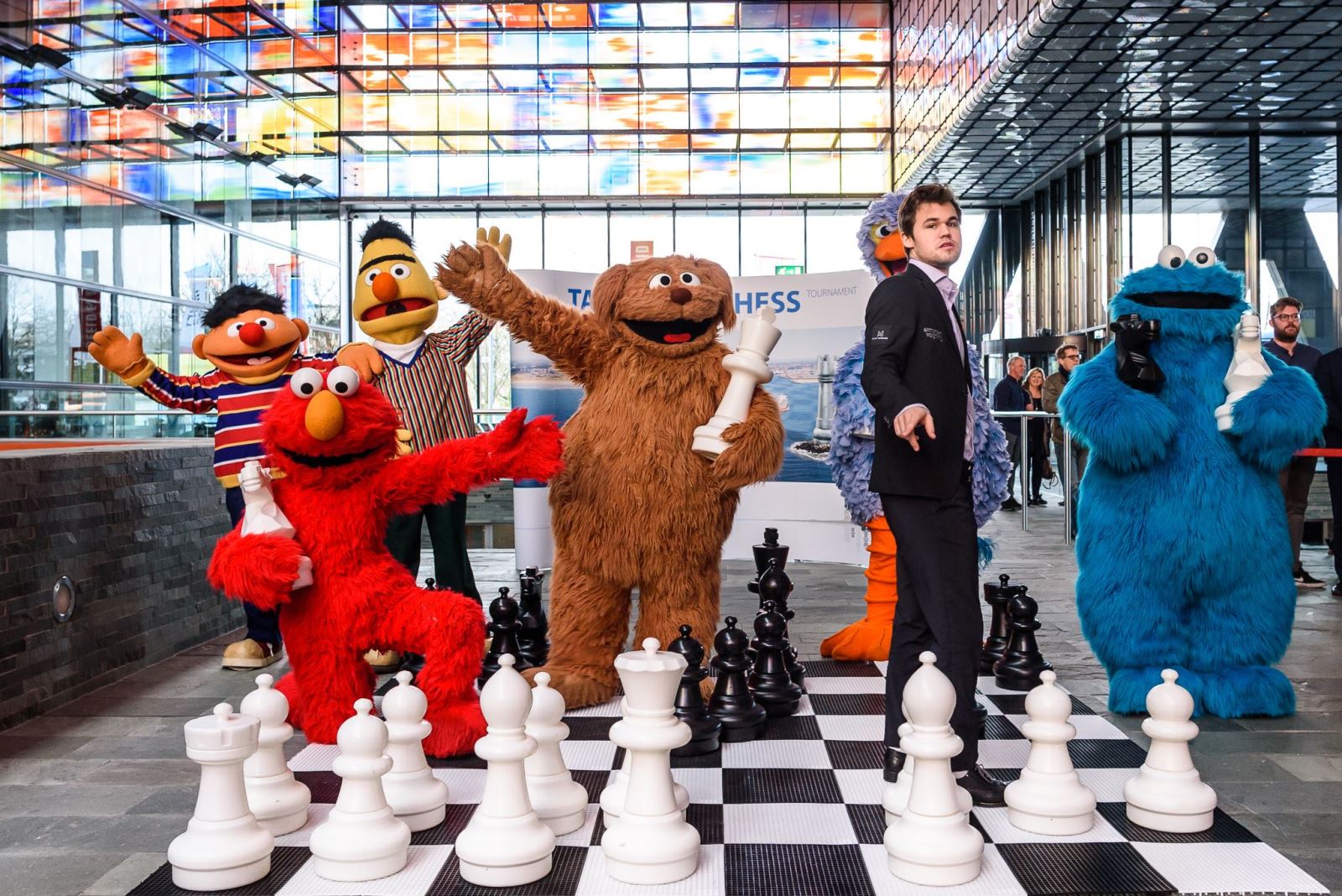 Magnus Carlsen with Seseme Street muppets