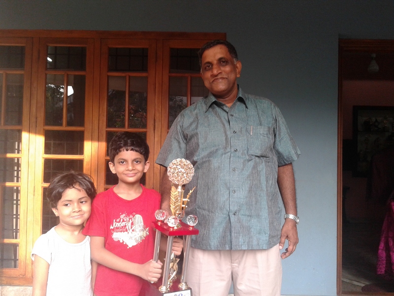 Nihal Sarin and his sister Neha with his first coach Matthew Josepth Pottoore