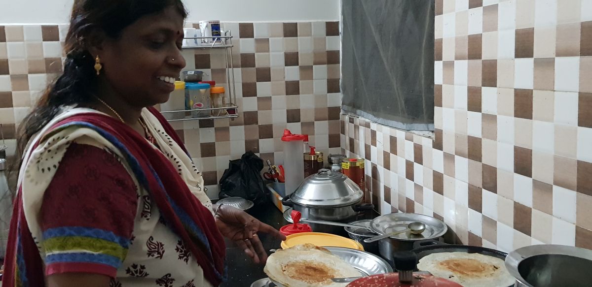 Adhiban's mother, Leela, in the kitchen