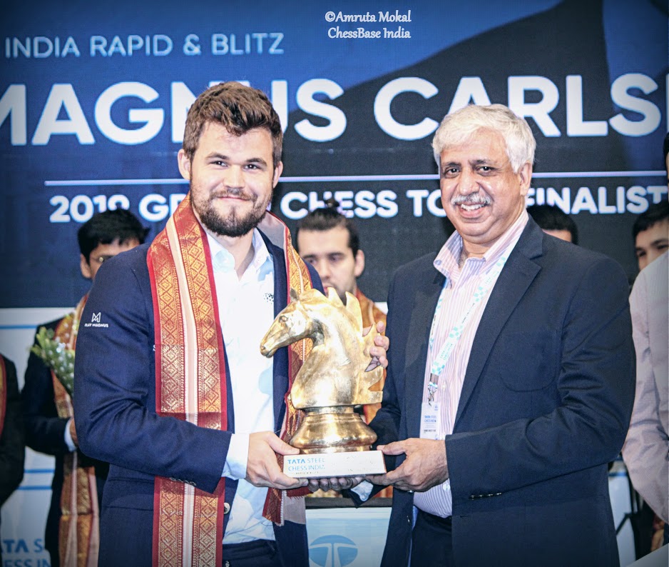 Carlsen with trophy