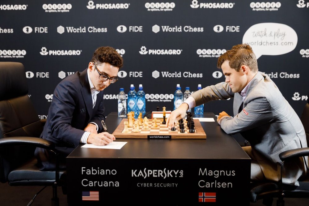 Magnus Carlsen forced to hold on for Game 2 draw with Fabiano Caruana – as  it happened, World Chess Championship 2018