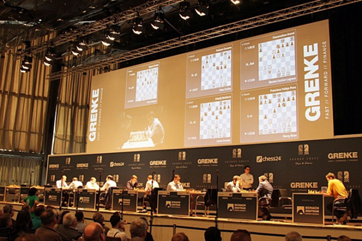 20 July 2019, Baden-Wuerttemberg, Karlsruhe: The 14-year-old Vincent Keymer  (r) plays at the chess tournament Grenke Open against world champion Magnus  Carlsen and is defeated only after the 81st move after 6:45